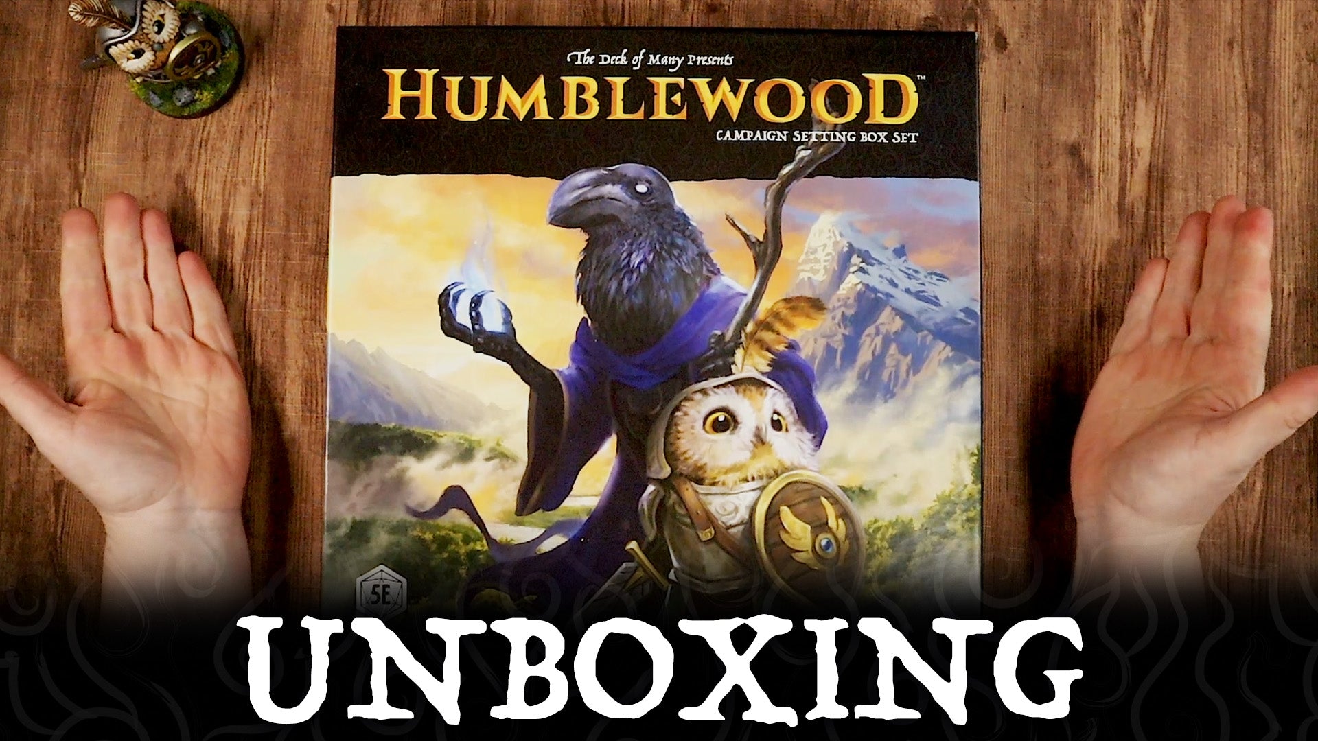 Humblewood Campaign Setting Unboxing, showing a book, maps, and reference cards.